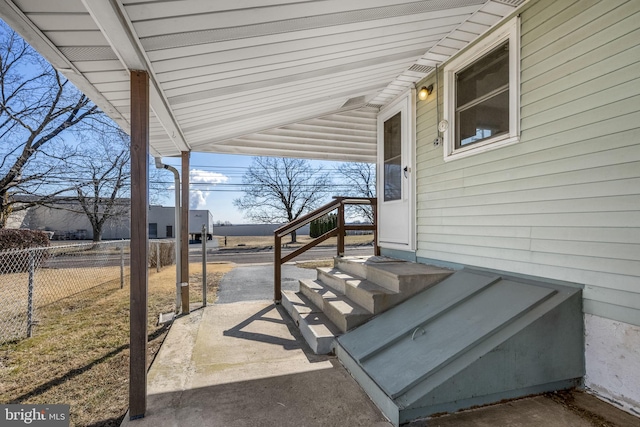 view of patio / terrace featuring fence