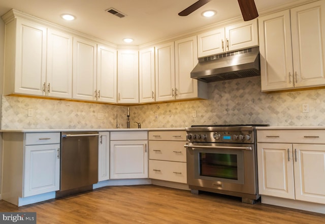 365 Heritage Way, Tuckerton, NJ 08087 - kitchen with appliances with stainless steel finishes, visible vents, light wood-style flooring, and under cabinet range hood