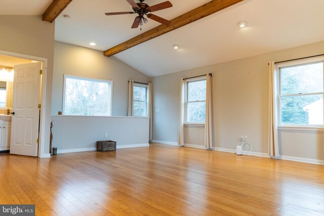 365 Heritage Way, Tuckerton, NJ 08087 - unfurnished living room featuring a wealth of natural light, light wood-type flooring, lofted ceiling with beams, and baseboards