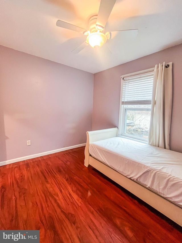 365 Heritage Way, Tuckerton, NJ 08087 - unfurnished bedroom with a ceiling fan, baseboards, and wood finished floors