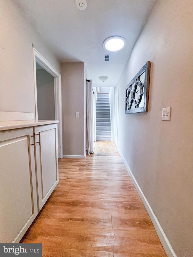 365 Heritage Way, Tuckerton, NJ 08087 - hall with light wood-style floors, baseboards, visible vents, and stairway
