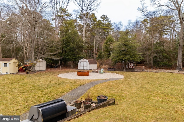 365 Heritage Way, Tuckerton, NJ 08087 - view of yard featuring an outbuilding, a storage unit, and an outdoor fire pit