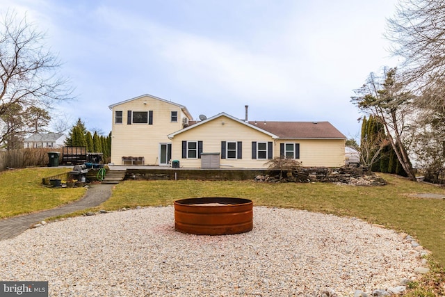 365 Heritage Way, Tuckerton, NJ 08087 - rear view of property with an outdoor fire pit, a deck, and a lawn