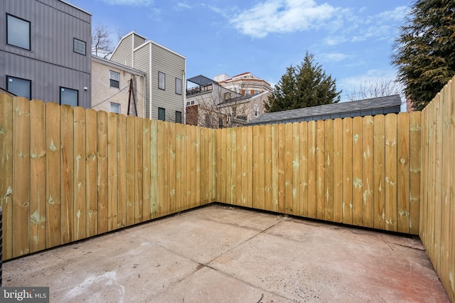 view of patio / terrace featuring fence