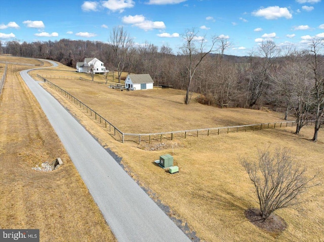 drone / aerial view with a forest view and a rural view