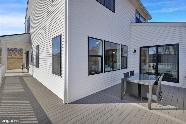 deck with outdoor dining space