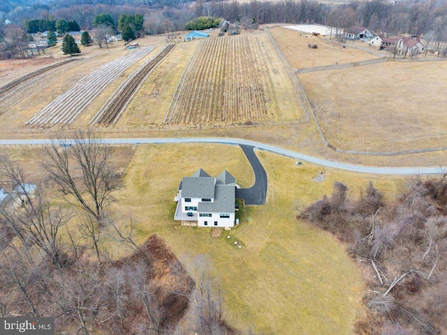 birds eye view of property with a rural view