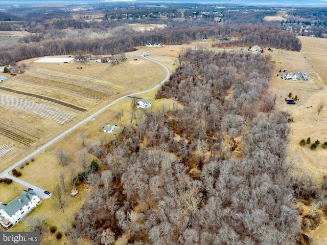 birds eye view of property featuring a rural view