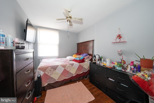 bedroom featuring dark wood-style flooring and ceiling fan