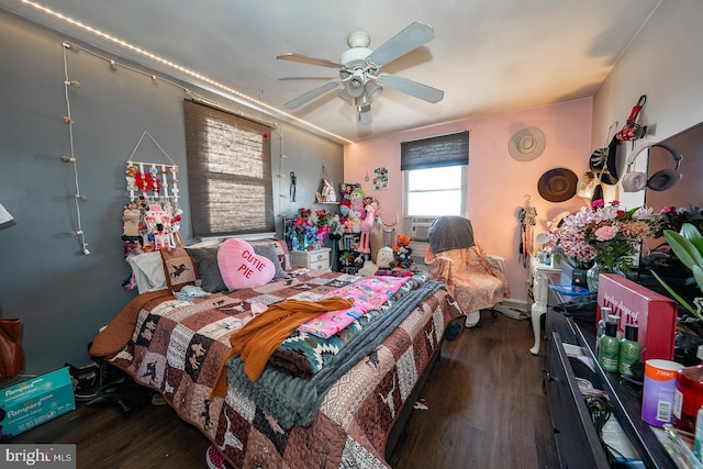 bedroom with ceiling fan and wood finished floors