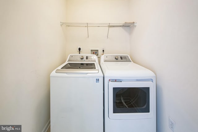 laundry area featuring laundry area and separate washer and dryer