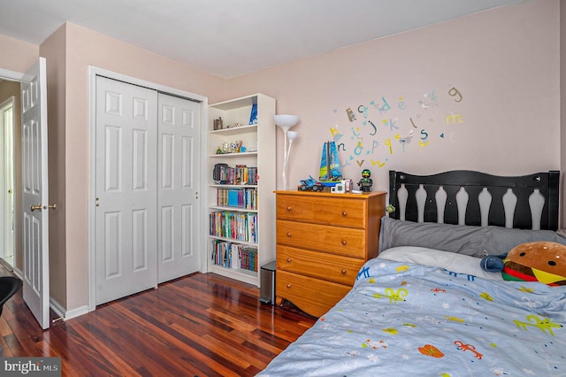 bedroom with a closet and wood finished floors