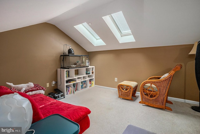 living area featuring lofted ceiling with skylight, baseboards, and carpet