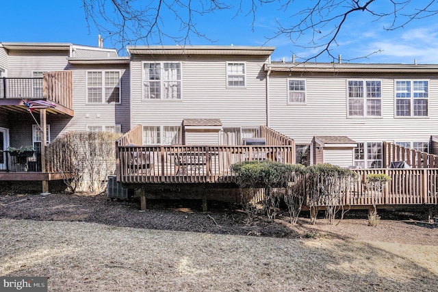 rear view of house with a wooden deck