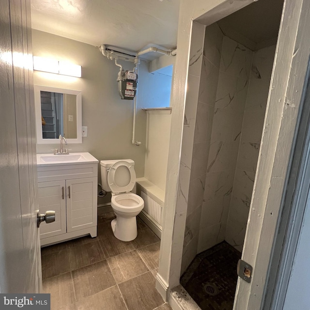 full bath with toilet, a shower stall, and vanity