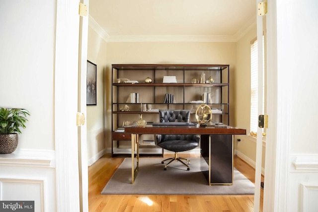 office with wood finished floors, baseboards, and ornamental molding