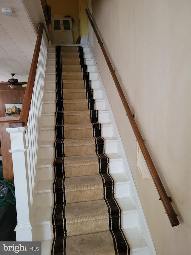 staircase with ceiling fan