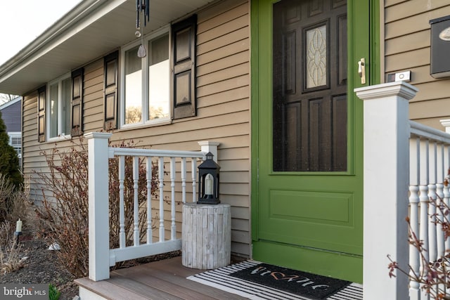 entrance to property featuring a porch