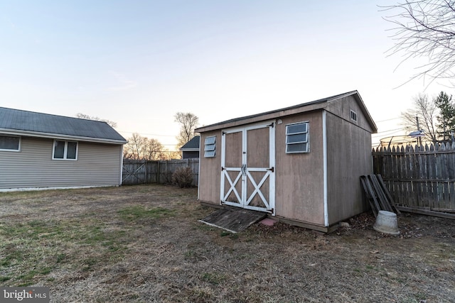 view of shed featuring a fenced backyard