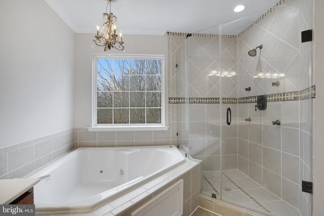 bathroom with a notable chandelier, ornamental molding, a whirlpool tub, a shower stall, and vanity