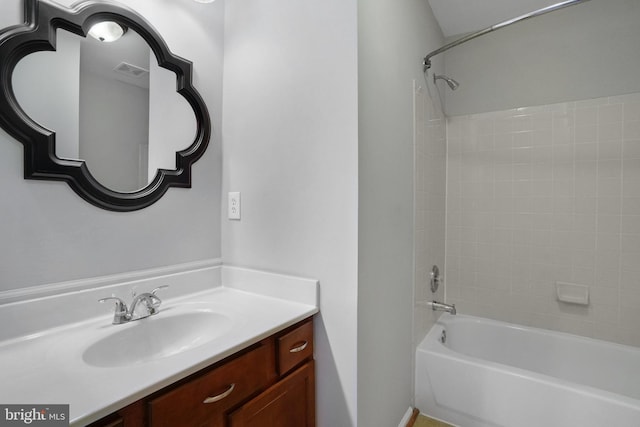 full bathroom with visible vents, shower / tub combination, and vanity