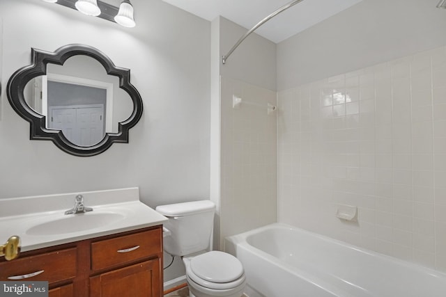 bathroom featuring shower / bath combination, toilet, and vanity
