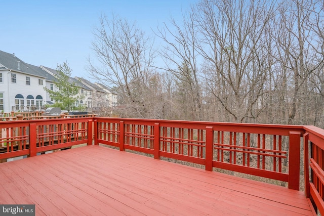 wooden deck featuring a residential view