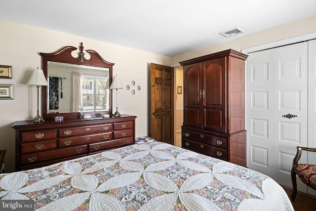 bedroom with a closet and visible vents