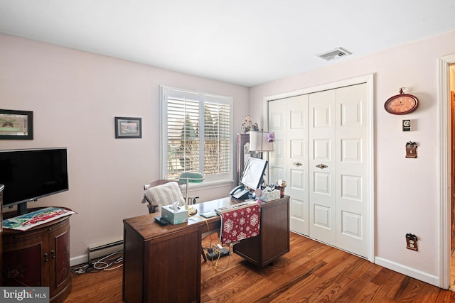 home office featuring dark wood-style floors, baseboards, visible vents, and baseboard heating