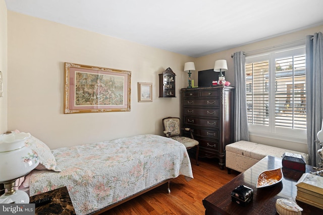 bedroom with wood finished floors