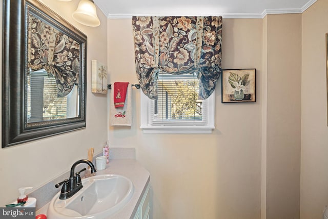 bathroom with vanity and crown molding