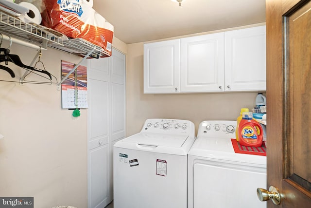 laundry room featuring washer and dryer and cabinet space