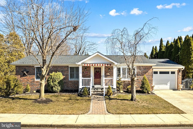 ranch-style home featuring a front lawn, concrete driveway, brick siding, and an attached garage