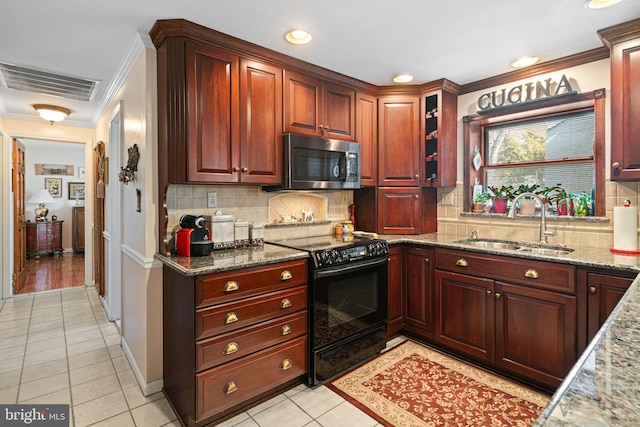 kitchen with visible vents, stainless steel microwave, ornamental molding, black range with electric stovetop, and a sink