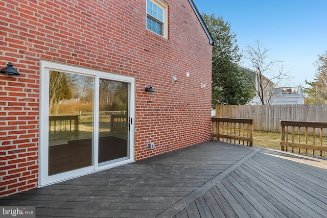 wooden deck featuring fence