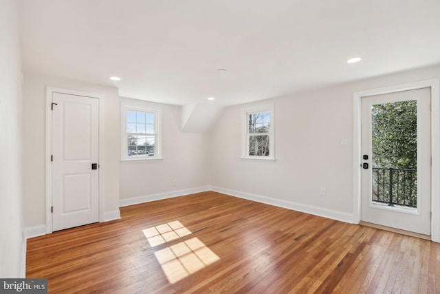 interior space with recessed lighting, light wood-type flooring, a wealth of natural light, and baseboards