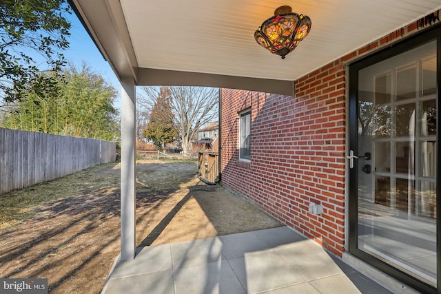 view of patio featuring fence