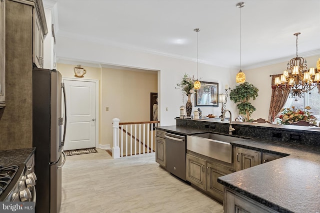 kitchen featuring stainless steel appliances, crown molding, and decorative light fixtures