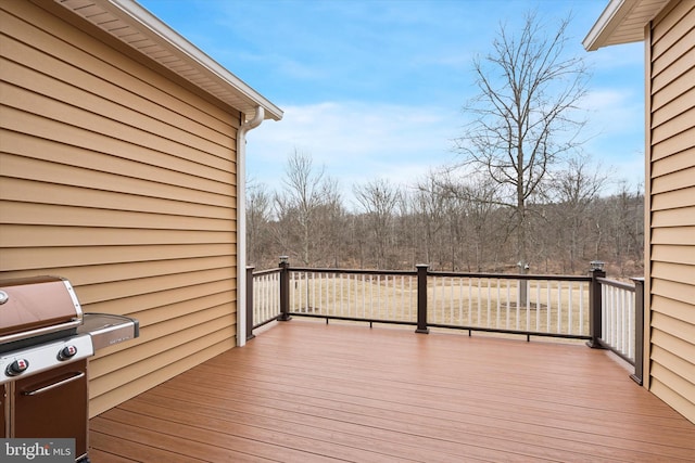 wooden terrace featuring area for grilling