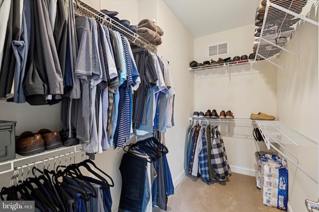 spacious closet with carpet floors and visible vents