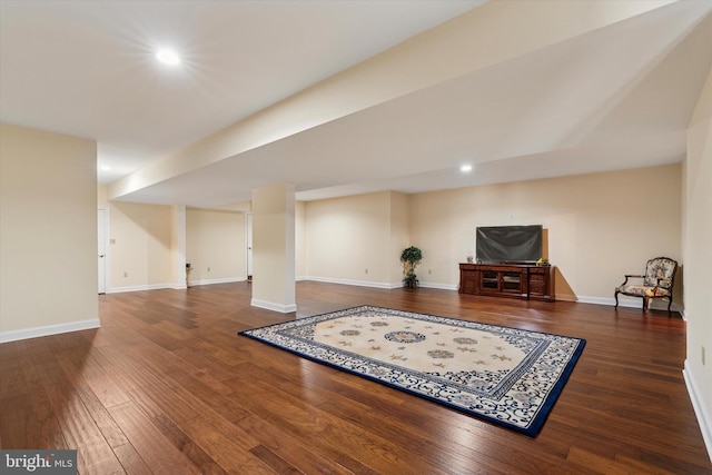 living area with hardwood / wood-style floors, recessed lighting, and baseboards