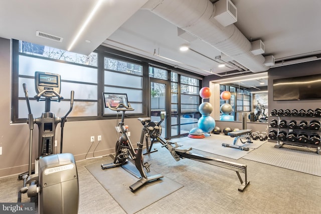 gym featuring visible vents and baseboards