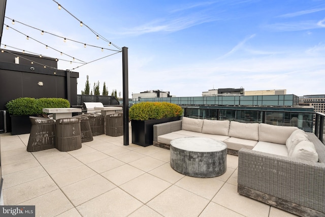 view of patio with an outdoor living space and exterior kitchen