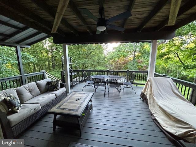 deck featuring an outdoor hangout area, ceiling fan, and outdoor dining area