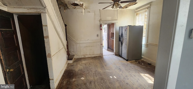 kitchen with ceiling fan and fridge with ice dispenser