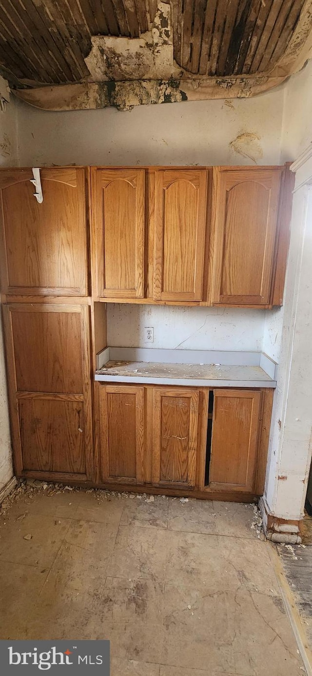 kitchen featuring brown cabinets and light countertops