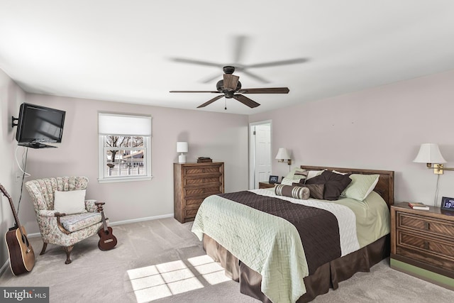 carpeted bedroom featuring ceiling fan and baseboards