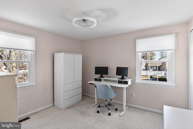 office area featuring carpet, visible vents, and baseboards