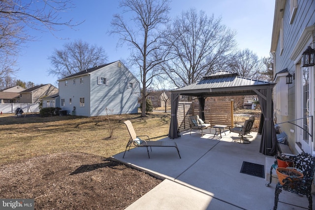 view of patio / terrace featuring a gazebo and fence