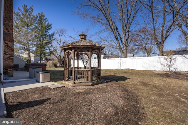 view of yard featuring fence and a gazebo